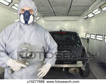Worker ready to paint a car close up. View Large Photo Image Stock Photo - Worker ready to paint a car close up.. Fotosearch