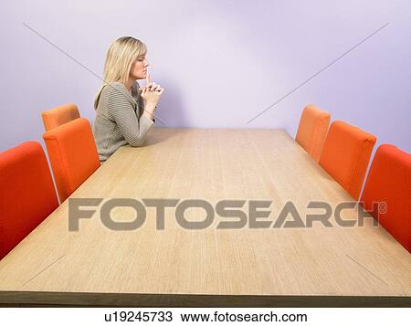 Pensive businesswoman at meeting table. View Large Photo Image Stock Image - Pensive businesswoman at meeting table.. Fotosearch