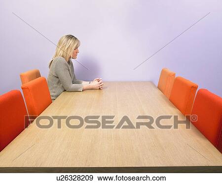 Pensive businesswoman at meeting table. View Large Photo Image Stock Photo - Pensive businesswoman at meeting table.. Fotosearch