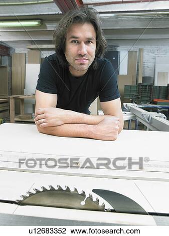 Portrait of carpenter in his workshop. View Large Photo Image Stock Image - Portrait of carpenter in his workshop.. Fotosearch