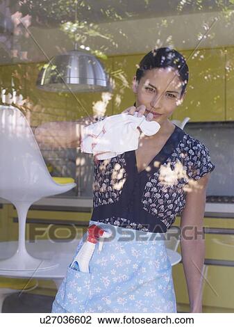 Young woman cleaning window View Large Photo Image Stock Image - Young woman cleaning window. Fotosearch