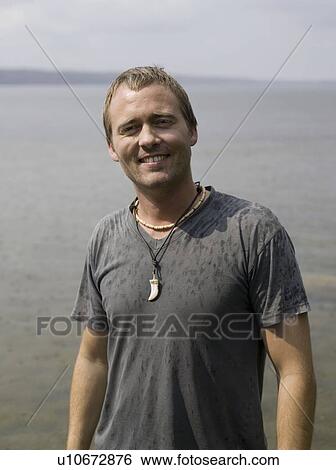 Man smiling into camera View Large Photo Image Stock Photograph - Man smiling into camera. Fotosearch