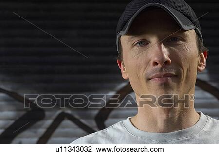 Man wearing cap, portrait, close-up View Large Photo Image Stock Image - Man wearing cap, portrait, close-up. Fotosearch