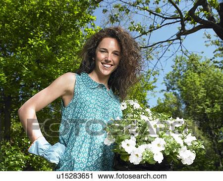 Woman working in the garden View Large Photo Image Stock Image - Woman working in the garden. Fotosearch