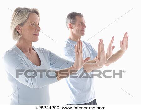 Stock Image - Mature couple doing yoga. Fotosearch