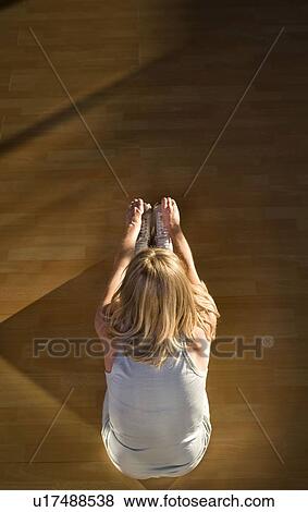 Mature woman stretching in a gym View Large Photo Image Stock Photo - Mature woman stretching in a gym. Fotosearch