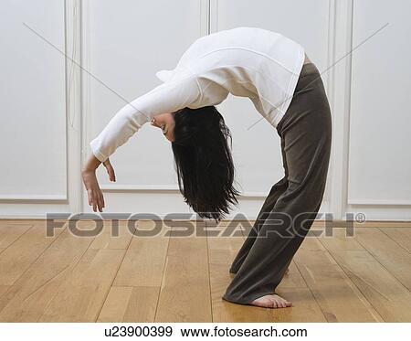 Stock Photo - Woman doing back bend. Fotosearch