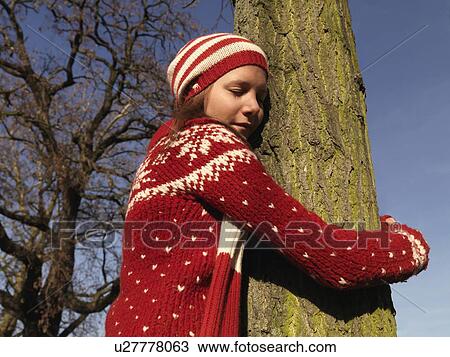 Woman hugging tree, eyes closed View Large Photo Image Stock Image - Woman hugging tree, eyes closed. Fotosearch