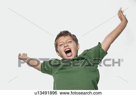 Stock Photograph - Young boy jumping and shouting. Fotosearch