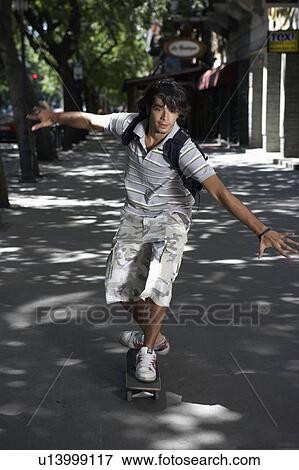 Young man on skateboard. View Large Photo Image Stock Photo - Young man on skateboard.. Fotosearch