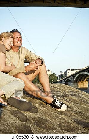 Stock Photo - Couple by riverside. Fotosearch