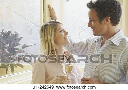 Couple in conversation in pub View Large Photo Image Stock Photo - Couple in conversation in pub. Fotosearch