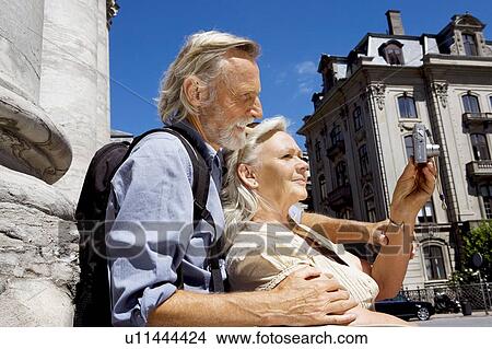 Picture - Couple looking at camera. Fotosearch