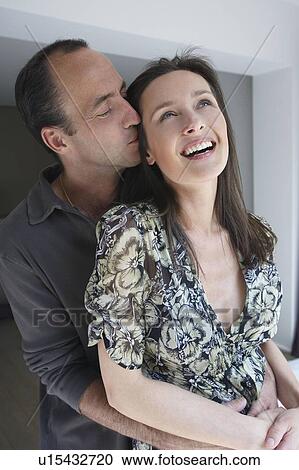 Stock Image - Couple smiling, portrait. Fotosearch