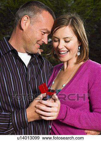 Stock Photo - Man proposing to woman. Fotosearch