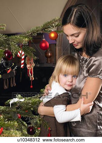 Mother and daughter hugging View Large Photo Image Stock Image - Mother and daughter hugging. Fotosearch