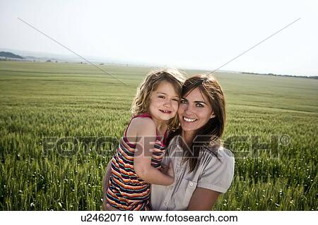 Stock Photograph - Woman and child in wheat-field. Fotosearch