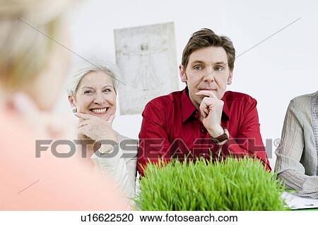 Stock Image - Business people in discussion. Fotosearch