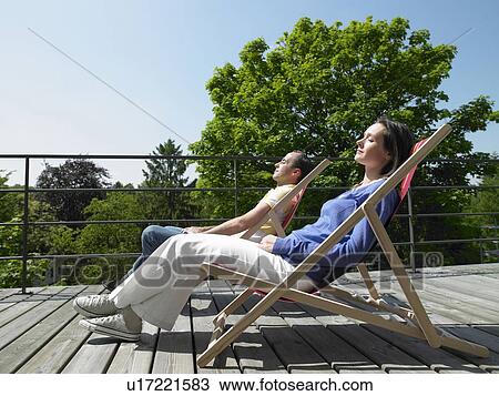 Stock Image - Couple enjoying the sun. Fotosearch