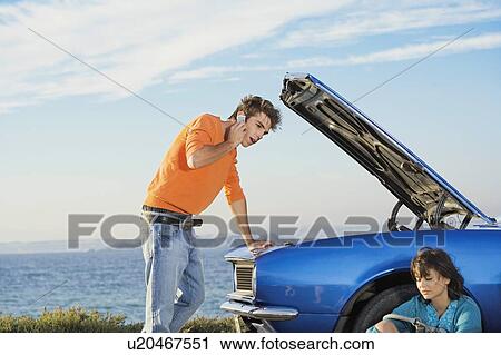 Man and woman by car. View Large Photo Image Stock Image - Man and woman by car.. Fotosearch