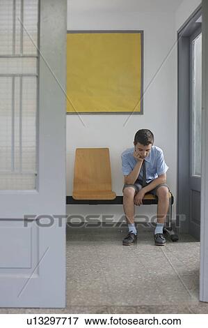 School boy sitting outside office View Large Photo Image Stock Photo - School boy sitting outside office. Fotosearch