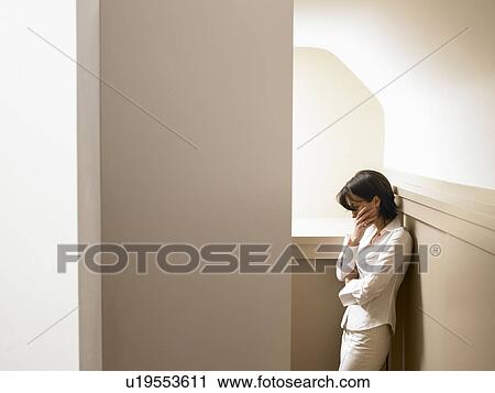 Stock Image - Woman in a corridor. Fotosearch