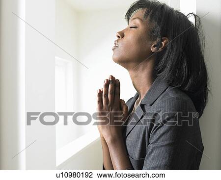 Woman leaning against a wall View Large Photo Image Stock Image - Woman leaning against a wall. Fotosearch