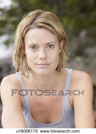 Woman looking at camera outdoors. View Large Photo Image Stock Image - Woman looking at camera outdoors.. Fotosearch