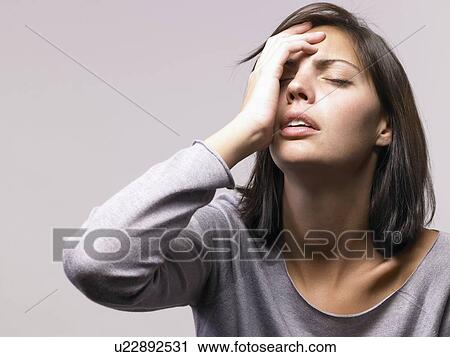 Stock Image - Woman looking depressed. Fotosearch