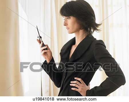 Woman with cell phone View Large Photo Image Stock Photo - Woman with cell phone. Fotosearch
