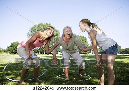 3 generation women with hula hops View Large Photo Image Stock Photography - 3 generation women with hula hops. Fotosearch