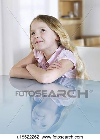 Stock Image - Dreamy portrait of young blonde girl. Fotosearch