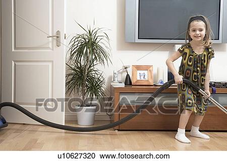 Stock Image - Girl doing housework. Fotosearch