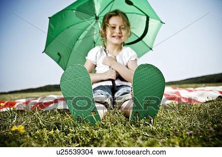 Picture - Girl wearing green shoes. Fotosearch