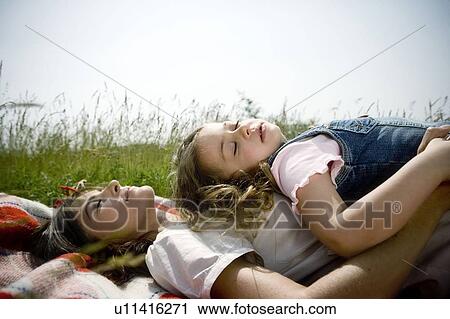 Stock Image - Mother and daughter asleep. Fotosearch