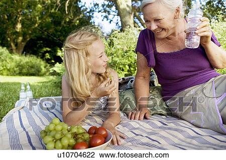 Picnic kid and grandmother View Large Photo Image Stock Image - Picnic kid and grandmother. Fotosearch