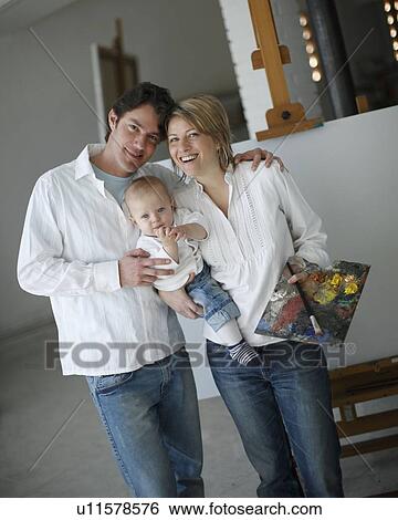 Stock Photograph - Family posing in art studio. Fotosearch