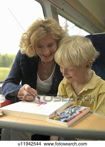 Grandmother and grandson on train View Large Photo Image Picture - Grandmother and grandson on train. Fotosearch