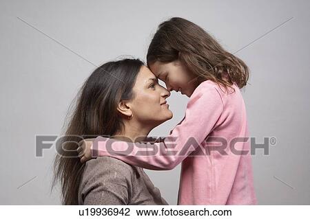 Mother face to face with daughter (5-7), side view View Large Photo Image Stock Image - Mother face to face with daughter (5-7), side view. Fotosearch