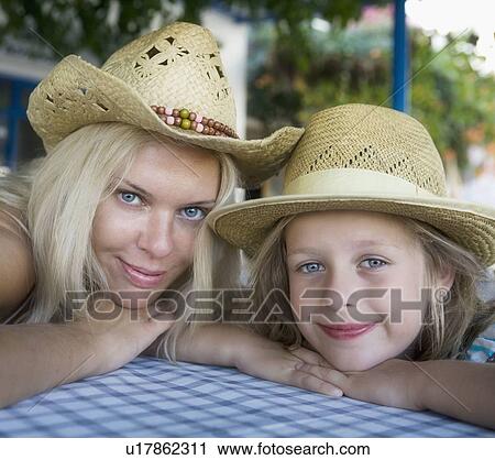 Woman with young girl at an outdoor restaurant smiling. View Large Photo Image Stock Image - Woman with young girl at an outdoor restaurant smiling.. Fotosearch