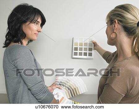 Female interior designer showing samples of color to client. View Large Photo Image Stock Image - Female interior designer showing samples of color to client.. Fotosearch