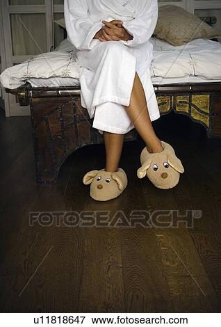 Woman in bedroom with toy slippers. View Large Photo Image Stock Photo - Woman in bedroom with toy slippers.. Fotosearch