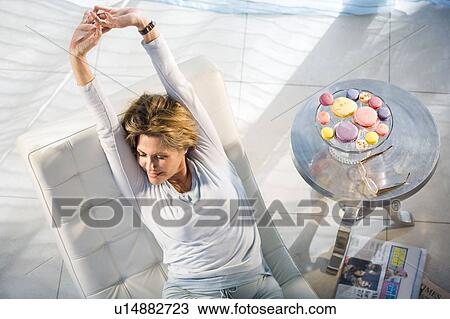 Stock Image - Woman Relaxing At Home. Fotosearch