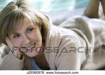 Stock Photo - Woman Relaxing At Home. Fotosearch
