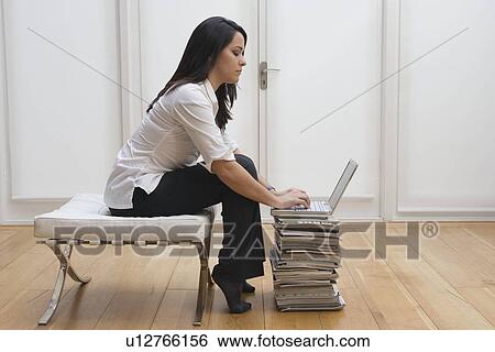 Stock Photograph - Woman working on computer . Fotosearch