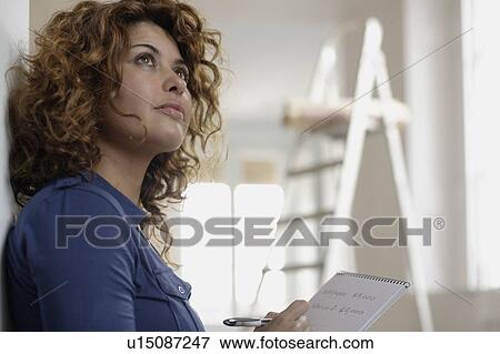 Woman writing notes View Large Photo Image Stock Photo - Woman writing notes. Fotosearch