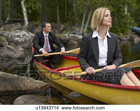 Business couple in a kayak View Large Photo Image Picture - Business couple in a kayak. Fotosearch