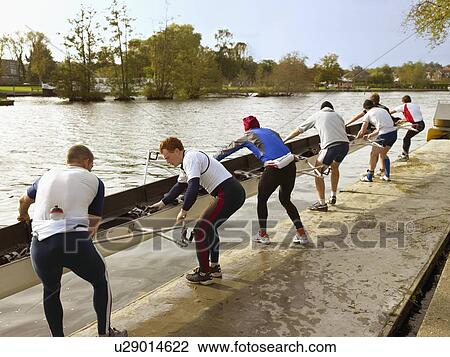 Crew with boat paused at waists. View Large Photo Image Stock Image - Crew with boat paused at waists.. Fotosearch