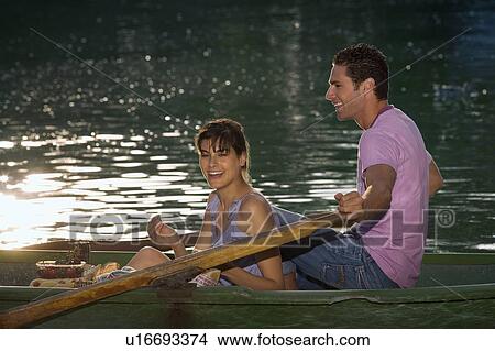 Picture - Man and woman in a boat. Fotosearch