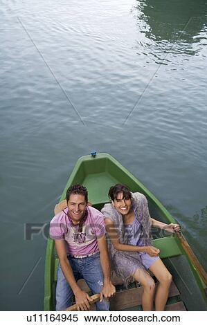 Stock Photography - Man and woman in a boat. Fotosearch